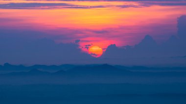 Sunrise and blue mountain with mist.