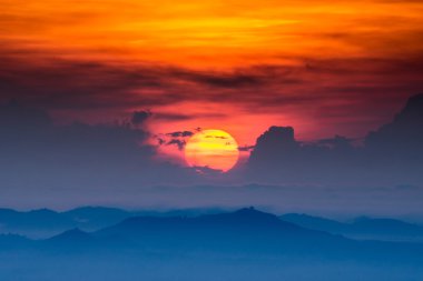 Sunrise and blue mountain with mist.