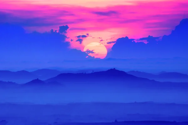 Sunrise and blue mountain with mist. — Stock Photo, Image