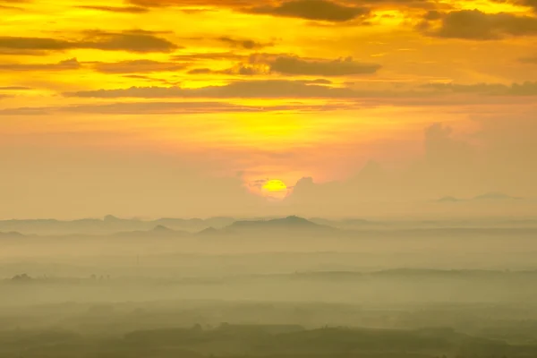 Sunrise and blue mountain with mist. — Stock Photo, Image