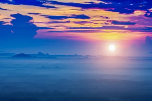 Sunrise and blue mountain with mist. — Stock Photo, Image