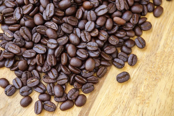Hot coffee on the wood and roast coffee bean. — Stock Photo, Image