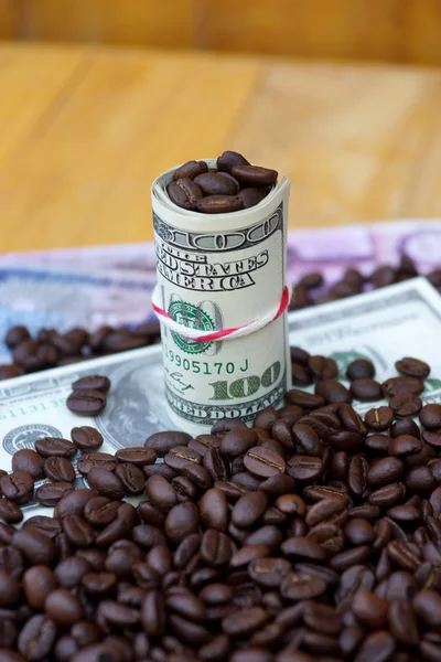 Money and roast coffee bean. — Stock Photo, Image