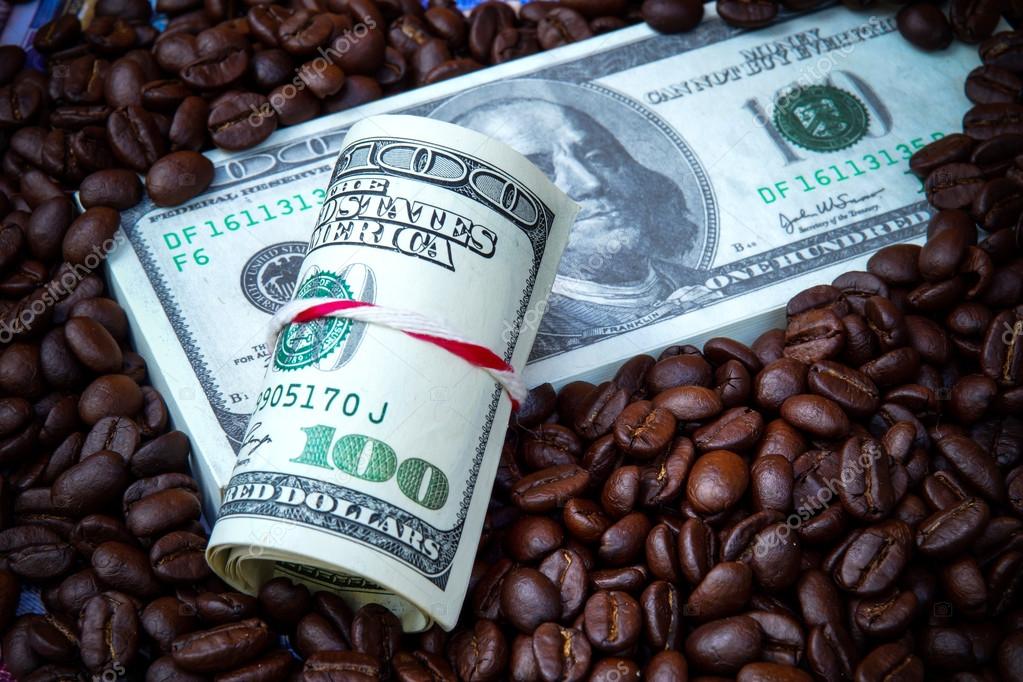 Money and roast coffee bean. — Stock Photo © Noppharat_th 68648405