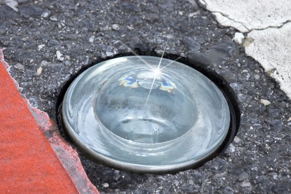 Round glass reflector on the road To prevent damage — Stock Photo, Image