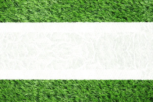 Top view of artificial turf and white space background. — Stock Photo, Image