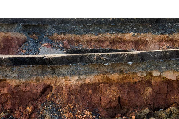 The curb erosion from storms. To indicate the layers of soil and — Stock Photo, Image
