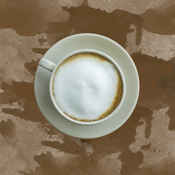 Süt üzerinde kahverengi zemin kahve. — Stok fotoğraf