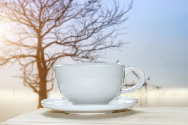 White coffee cup with blur morning background. — Stock Photo, Image