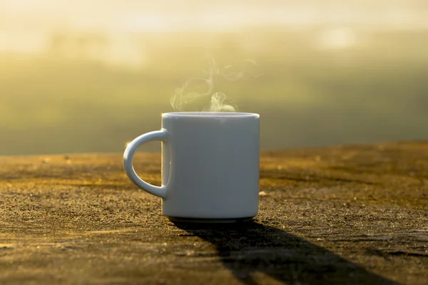 White Coffee cup with sunset time. — Stock Photo, Image