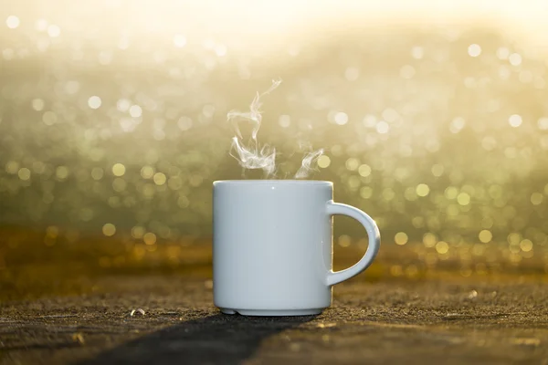 White Coffee cup with sunset time. — Stock Photo, Image