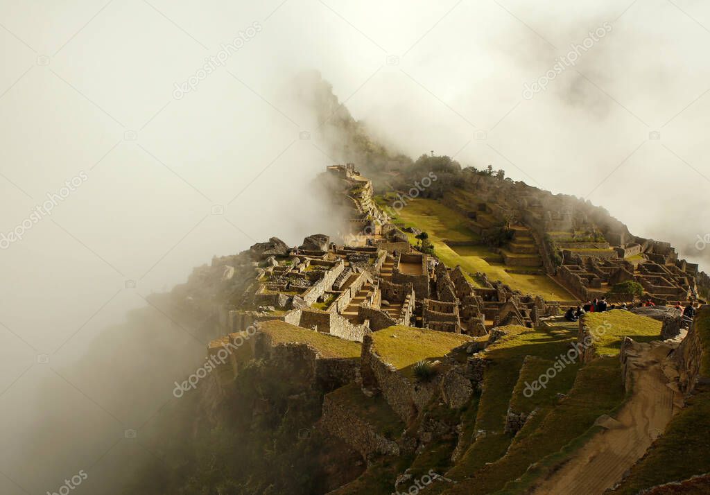 Machu Picchu Revealed from Early Morning Clouds. Urubamba, Peru