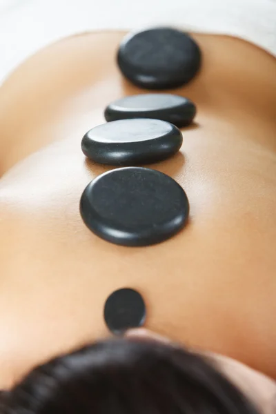 Hot stone massage therapy Royalty Free Stock Photos