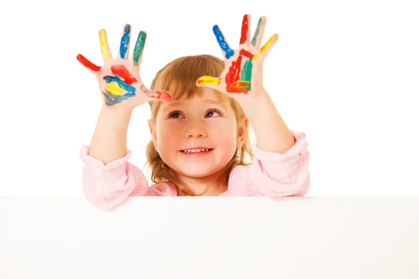 Preschooler girl with painted hands — 图库照片