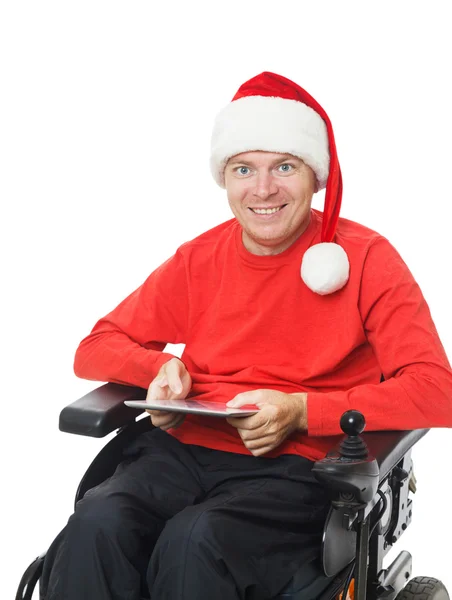 Santa hålla en digital tablet — Stockfoto