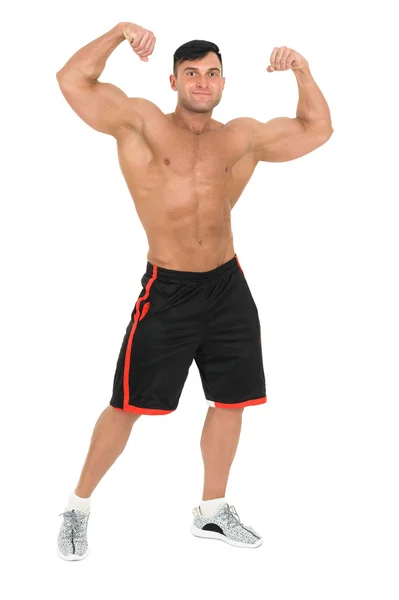 Jonge knappe bodybuilder man poseren voor fitness mode-shoot. Geïsoleerd op wit. — Stockfoto
