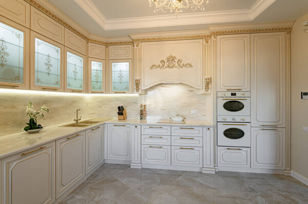 Luxury beige and gold classic kitchen interior