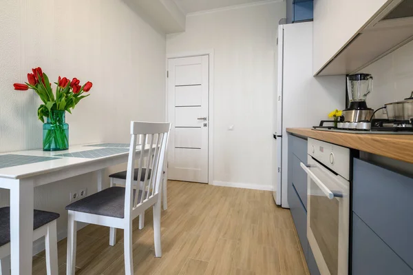 Cozy modern kitchen interior, some drawers pulled out