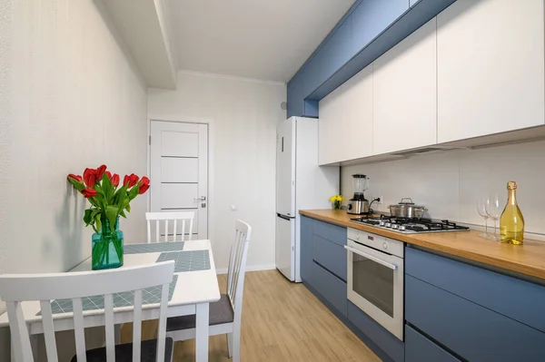 Cozy modern kitchen interior, some drawers pulled out