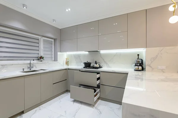 Open drawers at modern white kitchen furniture — Stock Photo, Image