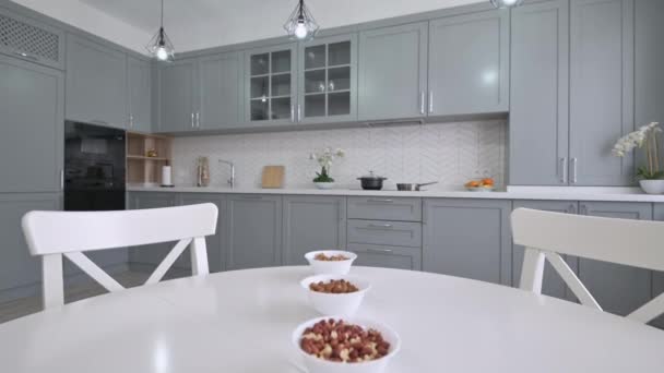 Large luxury moden classic gray kitchen with white dining table — Stock Video