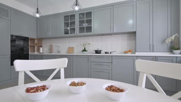 Large luxury moden classic gray kitchen with white dining table — Stock Video