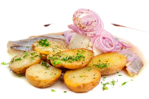 Roast potatoes with hering and onion — Stock Photo, Image