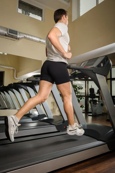 Man running on treadmill — Stock Photo, Image