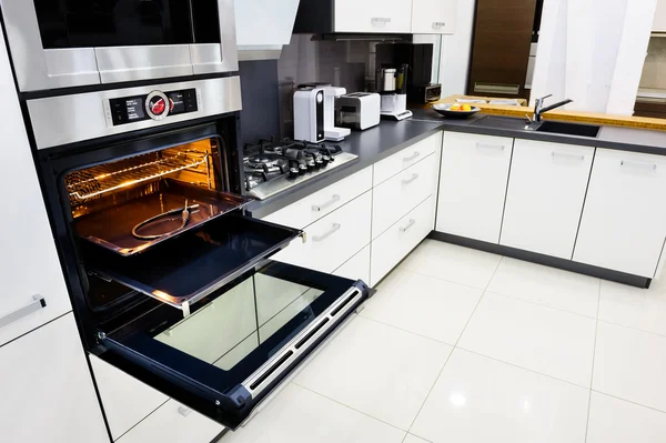 Modern hi-tek kitchen, oven with open door — Stock Photo, Image