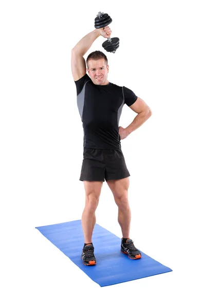 立っている上腕三頭筋拡張ダンベル トレーニング — ストック写真