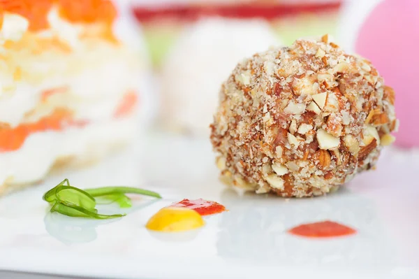 Unusiual nut ball with salmon sauce — Stock Photo, Image