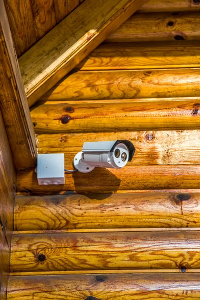 Security camera on the wooden house