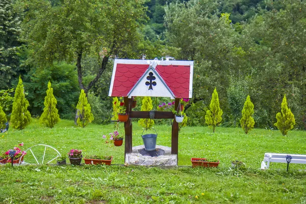 Small Water Well Garden — Stock Photo, Image