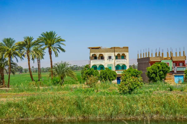 Poor buildings on the Nile canal near Qena, Egypt