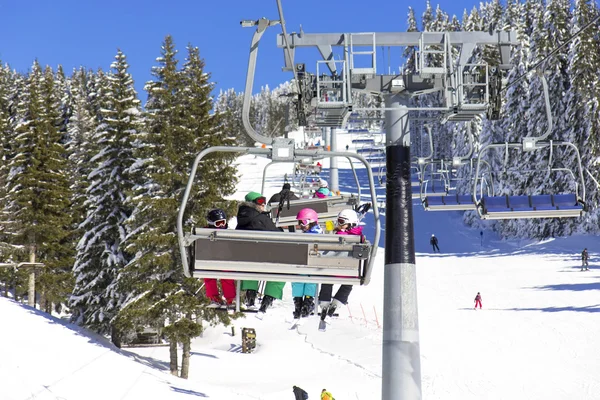Family on the ski lift — Stock Photo, Image