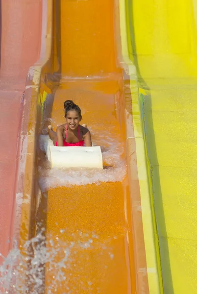 Girl on  the water slide — Stock Photo, Image