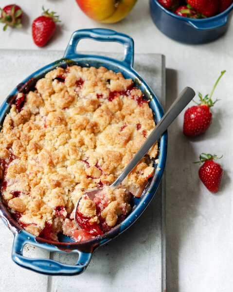 Apple and Strawberry Crumble with summer strawberries and autumn apples.