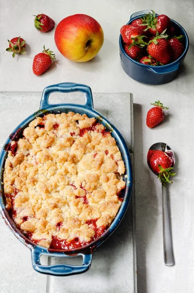 Apple and Strawberry Crumble with summer strawberries and autumn apples.