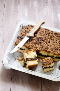 Close-up view of coffee cake has a ribbon of coffee filling and a crisp streusel topping. 