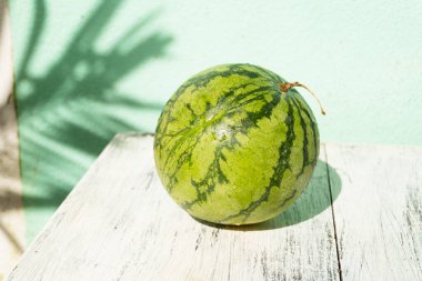 close-up of fresh ripe melons on wooden table