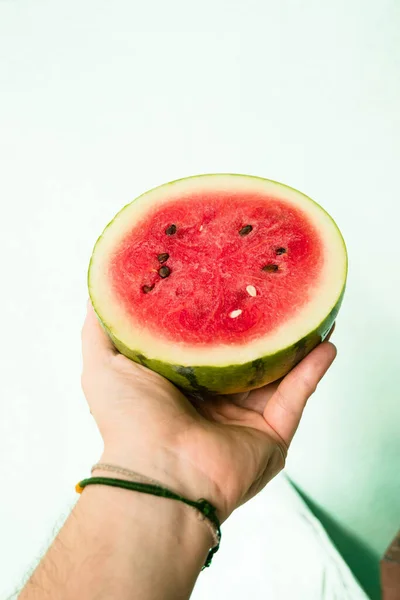 Fresh ripe juicy watermelon on a color background.