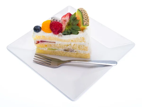 Fruits cake on dish with fork isolated on white background — Stock Photo, Image