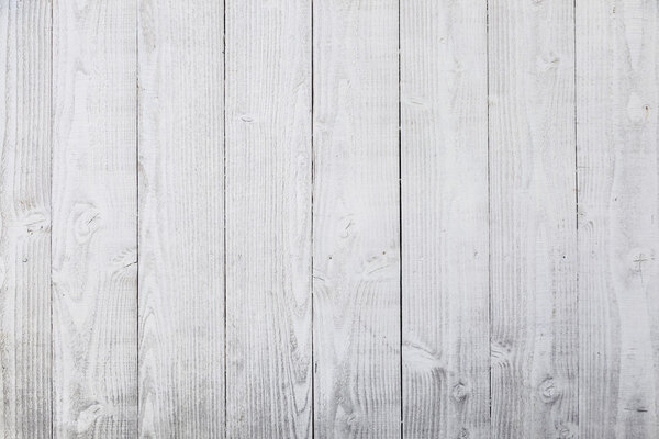 vertical planks of white painted worn planks on fence or door