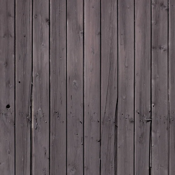 Fence of vertical old brown purple planks or side of shed — Stock Photo, Image