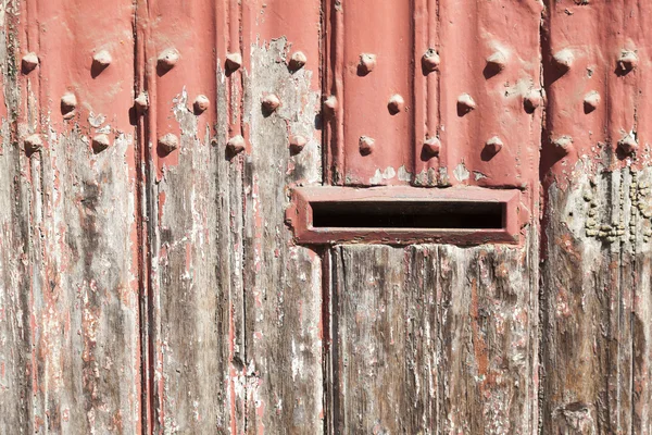 Horizontal part of wooden door with old bladdered gray paint and — Stock Photo, Image