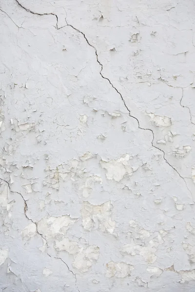 Part of old wheathered white stucco full of cracks on outside wa — Stock Photo, Image