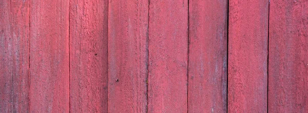 Part of shed built of vertical red painted planks — Stock Photo, Image