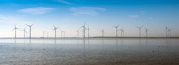 Wind turbines under blue sky on philipsdam in dutch province of Zeeland — Stock Photo, Image