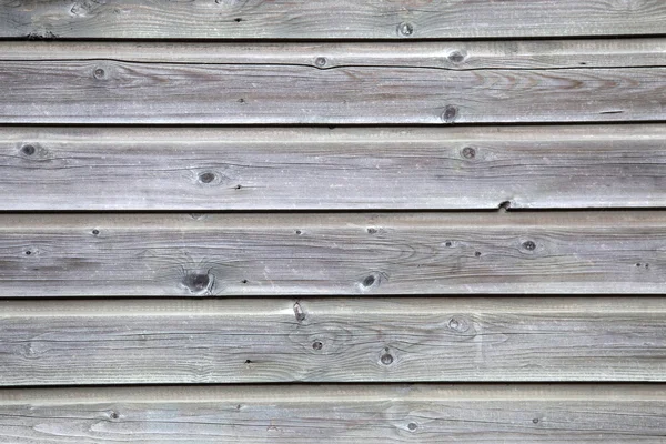 Grijze planken van oude hek — Stockfoto