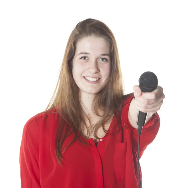 Young brunette with microphone in studio — Stock Photo, Image